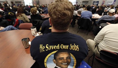 
              In this Nov. 6, 2012 photo, United Auto Workers member Harry Van Uden attends a rally on Election Day at the UAW Region 1 technical training center in Warren, Mich. Only a couple of wee
